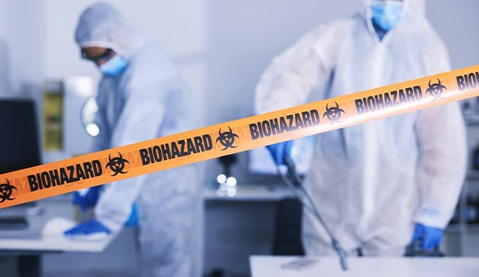 Professional team performing biohazard cleanup service
