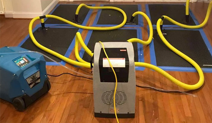 Hardwood floor water damage restoration drying system