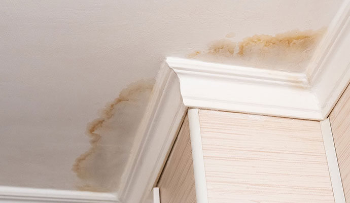 Water damage stains on a residential ceiling
