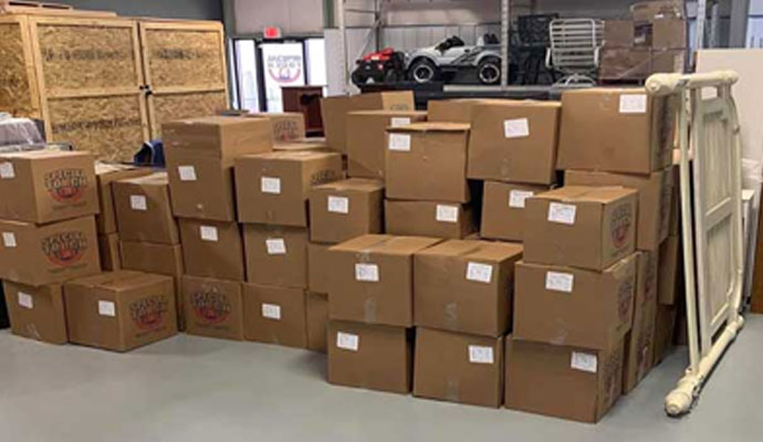 Contents packout boxes stacked in storage warehouse