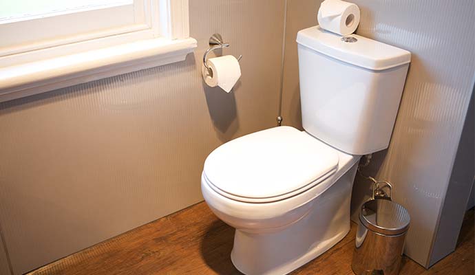 Freshly installed and spotless toilet with proper plumbing setup.
