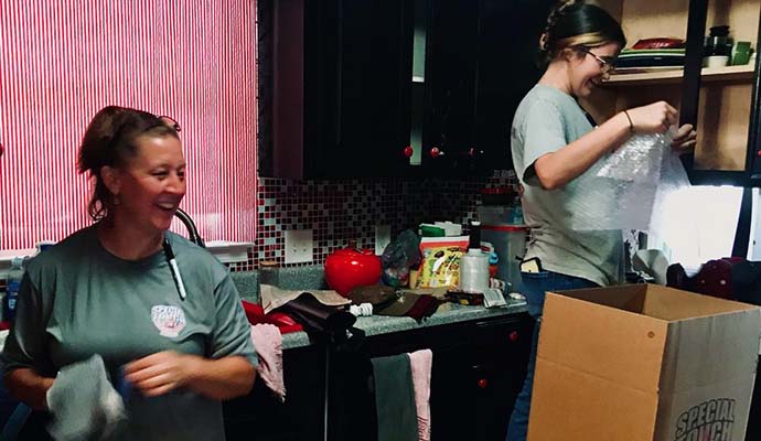 Professional kitchen content restoration services Content restoration team restoring kitchen items after damage