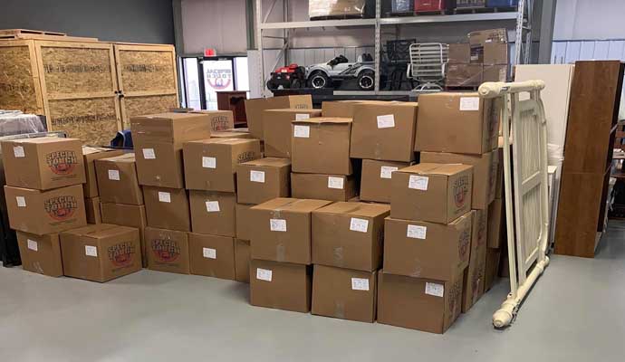 Organized packed content boxes stored in a commercial storage facility
