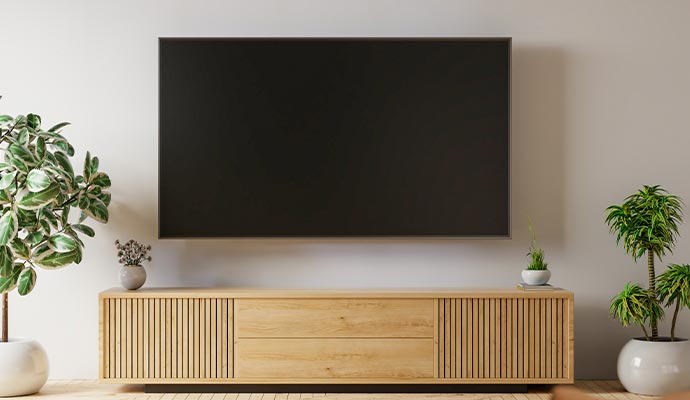 Wall-mounted flat-screen TV in a modern living room